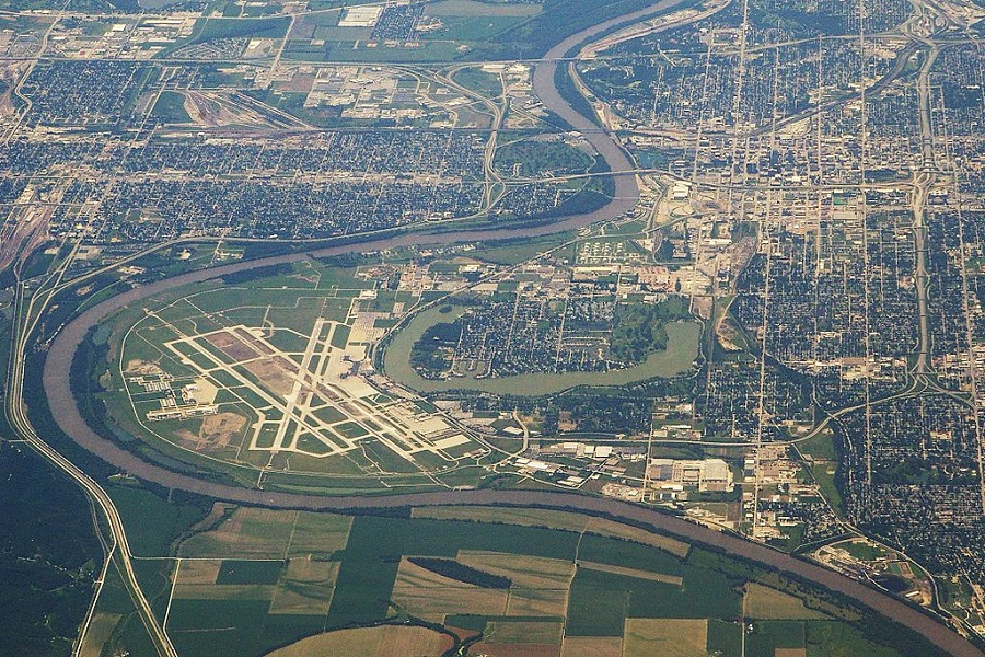 City of Omaha and Epply Airfield, with the Missouri River forming the border between Iowa (on the left) and Nebraska (on the right). Council Bluffs, IA on the upper left corner. Taken from an altitude of 36,000 feet, looking south.
