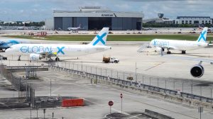 Two Airbus A321 passenger-to-freighter aircraft sit on the tarmac at Miami International Airport