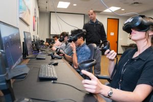 Trainees using a VR headset to practice skills they will need as pilots.
