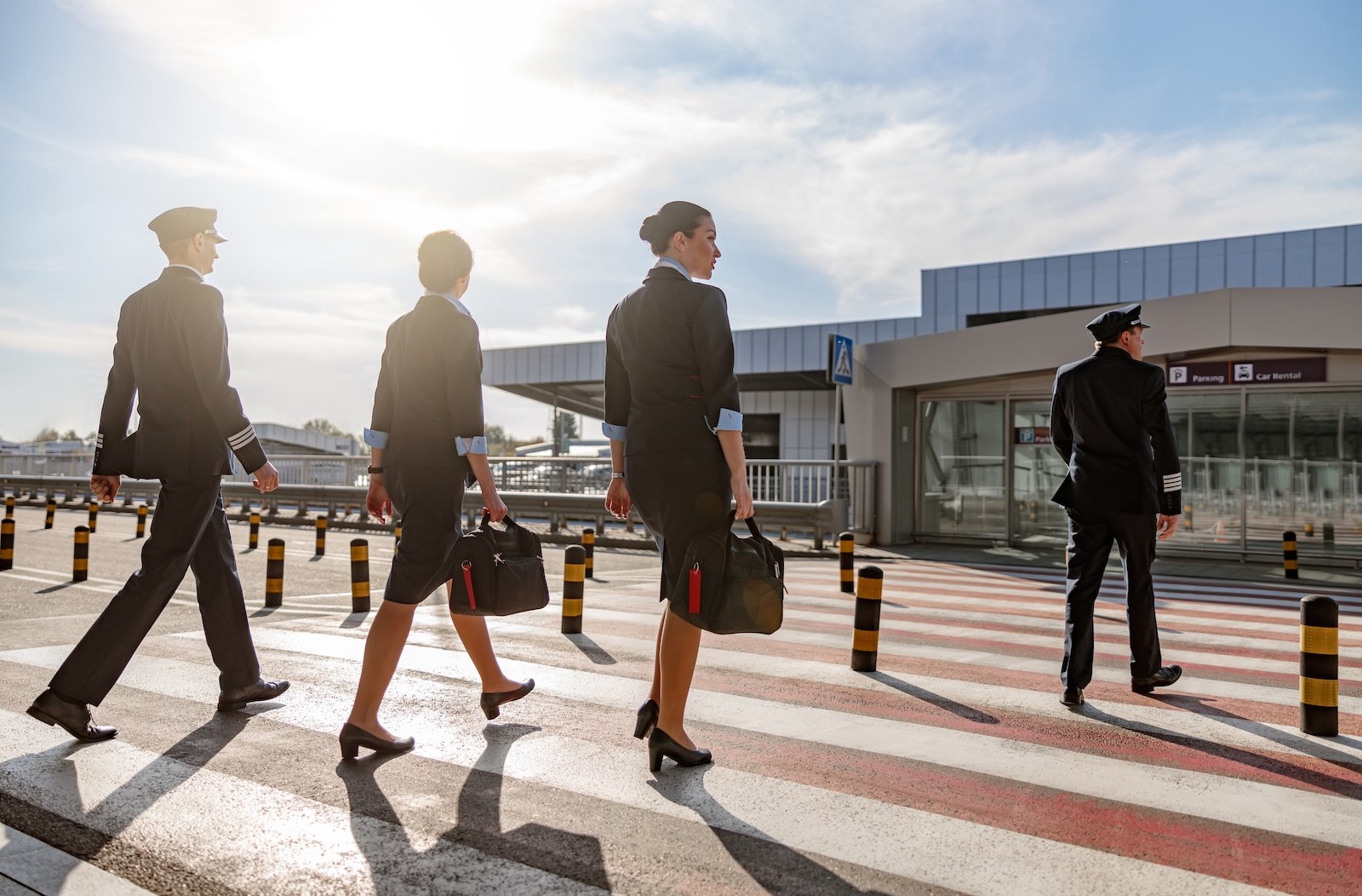Flight attendants with bags