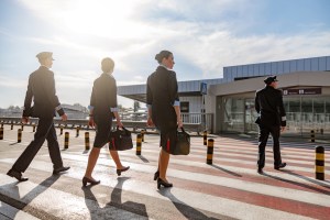 Flight attendants with bags