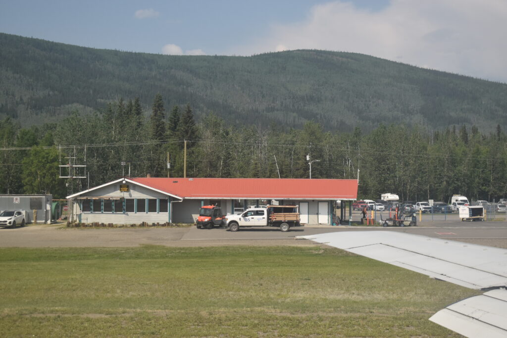 Taxiing out to the runway, past the passenger terminal in Dawson City, Yukon.