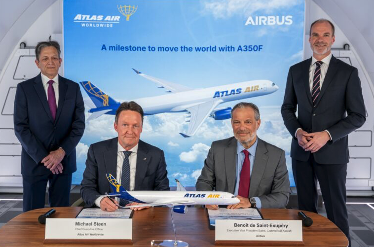 Michael Steen, CEO of Atlas Air Worldwide, and Benoit de Saint-Exupéry, Airbus' executive vice president of sales for commercial aircraft, at the order signing ceremony in Toulouse, France.